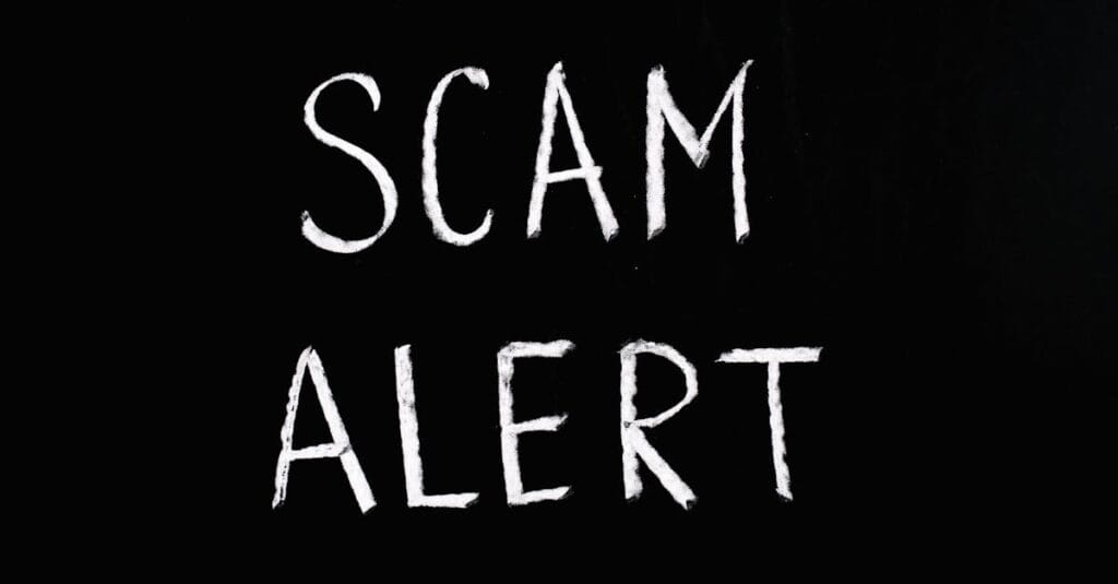 most common type of online fraud - Blackboard with 'Scam Alert' written in white chalk, emphasizing a warning concept.